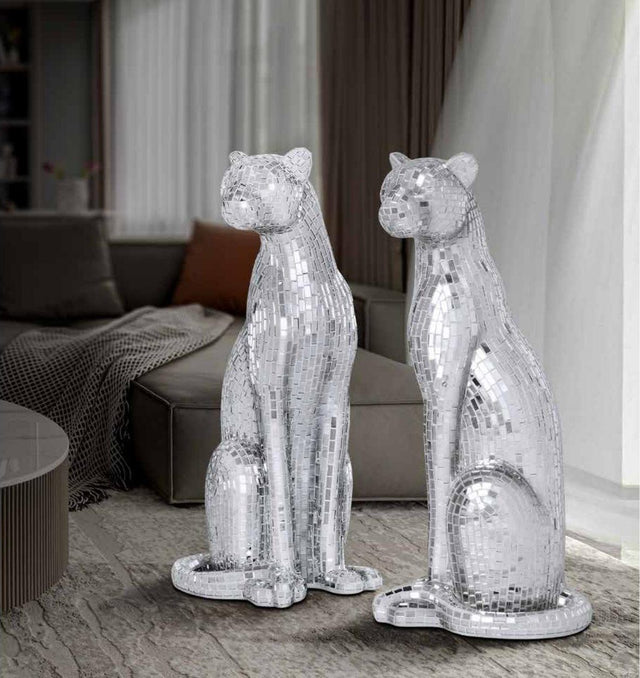 Pareja de panteras de cristal sentadas